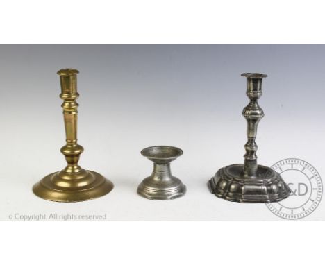 An 18th century German pewter candlestick, c1740, 18cm, with a French brass candlestick and a salt (3)