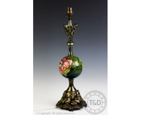 A cast brass table lamp, with Moorcroft type spherical centre section decorated with an Hibiscus pattern, 45cm high, with a 1