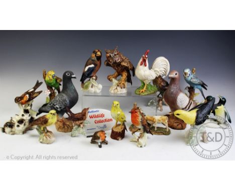 A collection of eleven Goebel birds, including a chicken, two budgies etc, with Goebel 'Wildlife Collection' advertising sign