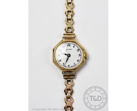 A ladies 9ct yellow gold Buren wristwatch, Birmingham 1948, the octagonal case enclosing white enamel dial with black numeral