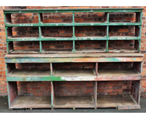 A vintage painted pine open rack of shelves, with twelve alcoves below six alcoves, 219cm H x 292cm W x 62cm D (as found)