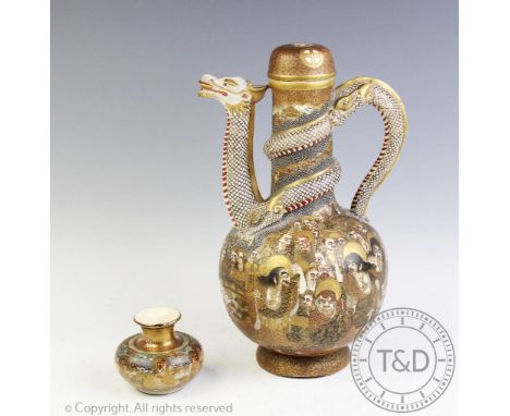 A Japanese Satsuma dragon ewer, Choshuzan, decorated with multiple immortal figures, dragon handle, neck and spout, 28cm high