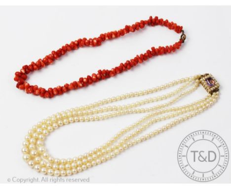A graduated three strand cultured pearl necklace with attached amethyst and seed pearl set 9ct gold clasp along with a single