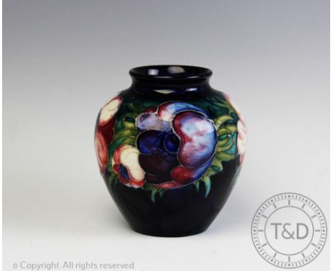 A Moorcroft anemone pattern vase, impressed marks, 10cm high CONDITION REPORT: Minor crazing. A few light glaze scratches, ot