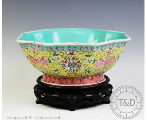 A Chinese porcelain water bowl and stand, Qianlong seal mark, 20th century, the moulded octagonal bowl externally decorated a