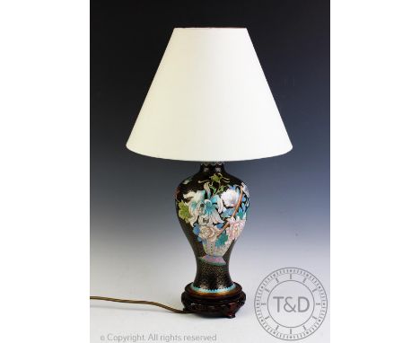 A 20th century cloisonne table lamp, decorated with flowers against a black ground, on pierced wood stand, 18cm high, (size n