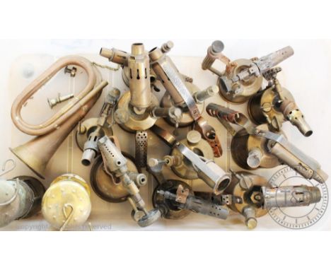 A selection of vintage brass and metal blow torches, with a copper and brass horn, a Davy lamp and a set of mounted antlers (