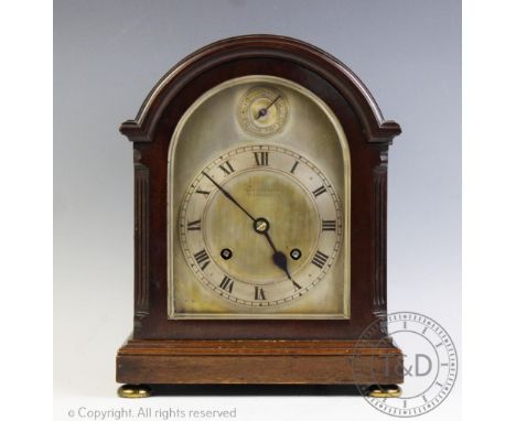 An early 20th century mahogany eight day mantel clock, silver dial and Roman numeral chapter ring signed Morath Bros Liverpoo