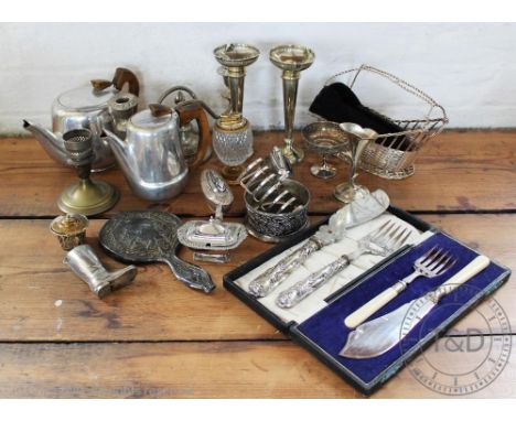 A collection of silver plated wares to include a Picquot Ware part tea service, a twin handled tray, a pair of candlesticks, 