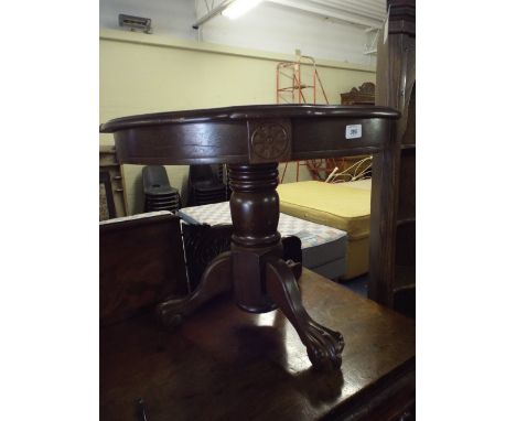 A Circular Drum Table on Tripod Support with Claw and Ball Feet
.