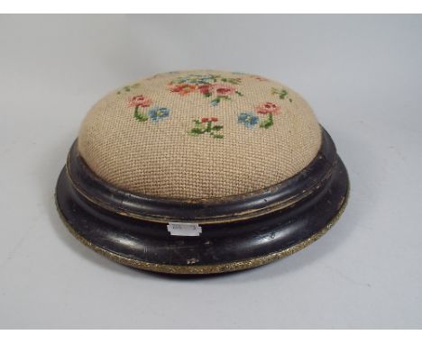 A Late Victorian Ebonised Circular Foot Stool with Tapestry Top.