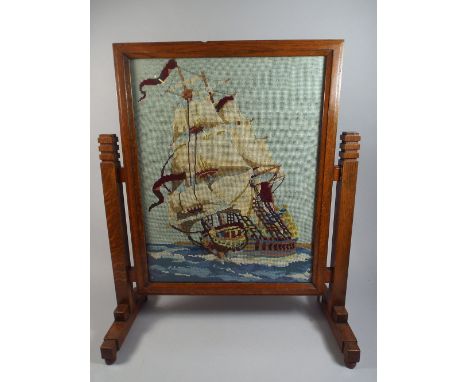 An Art Deco Oak Fire Screen with Tapestry Galleon Centre. 