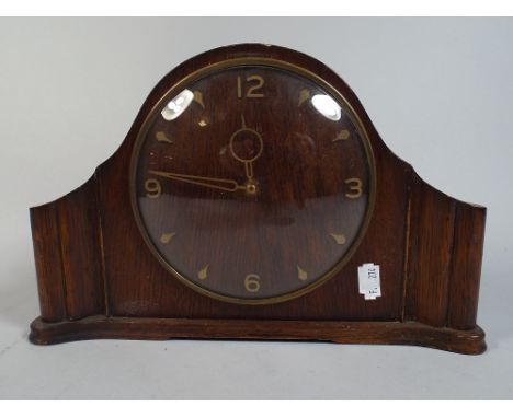 An Art Deco Oak Mantle Clock.