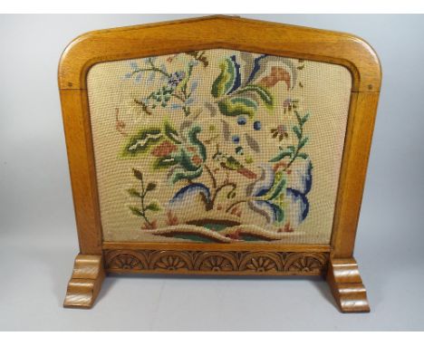 An Oak Fire Screen with Carved Bottom Rail and Tapestry Centre. 