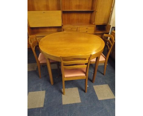A Nathan Extending Circular Dining Table and Four Ladder Back Chairs. 