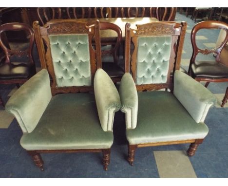 A Pair of Gents and Ladies Salon Arm Chairs with Button Backs and Oak Frames, Carved Top Rail.
