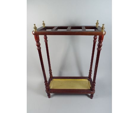 A Modern Four Section Stick Stand with Four Brass Finials.