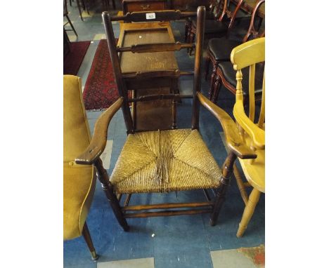 A Rush Seated Ladder Back Arm Chair.