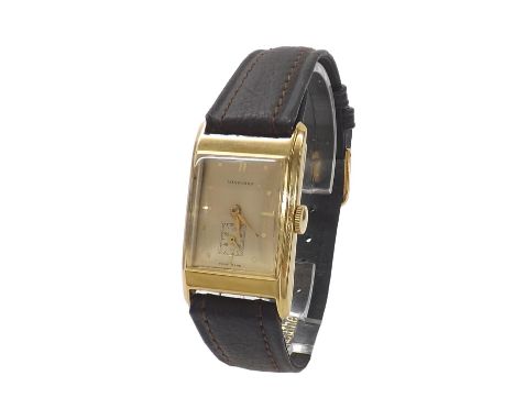 Longines 18k rectangular curved gentleman's wristwatch, circa 1944, the cream dial with baton markers and subsidiary seconds 