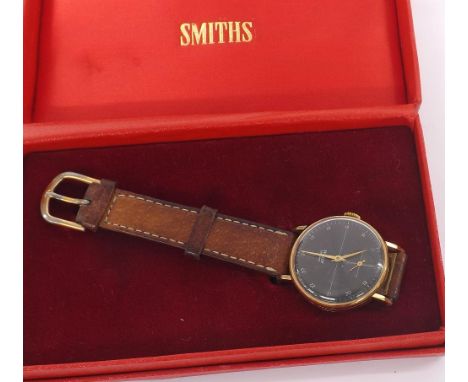 Smiths Astral 9ct gentleman's wristwatch, Birmingham 1957, circular black dial with Arabic twenty-four hour numerals, outer m
