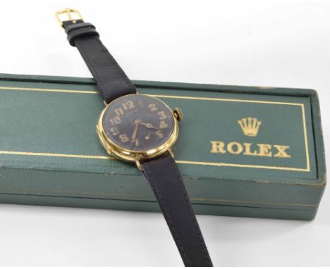 Rolex WWI 18k wire-lug gentleman's trench wristwatch, circular black dial with gilded Arabic numerals, luminous set hands and