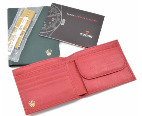 Two Rolex leather wallets (one green, one red); also a Tudor Black Bay manual booklet and strap