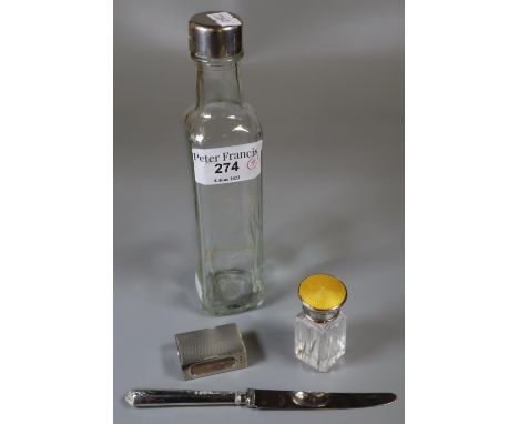 Silver topped glass bottle together wit ha collection of silver items to include: engine turned match holder, silver handled 