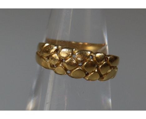 A yellow metal ring.  Ring size J.  Approx weight 3g.  (B.P. 21% + VAT) 