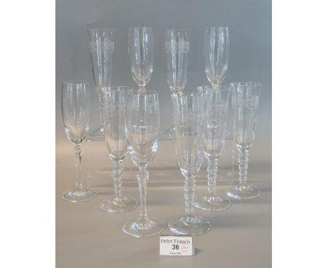 Set of six etched glass champagne fluted with bobbin stems, together with another set of four similar etched glass champagne 