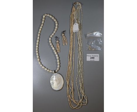 A Freshwater rice pearl necklace and earrings and a cultured freshwater pearl necklace.(B.P. 21% + VAT) 