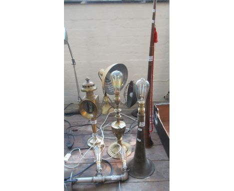 Group of assorted novelty table lamps to include two hunting horn lamps, double plumbing pipe lamp, brass base lamp and a bra