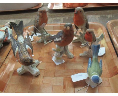 Collection of Goebel West Germany figurines of birds to include three Robins, Blue Tit, and two others. (6 figures.)(B.P. 21%