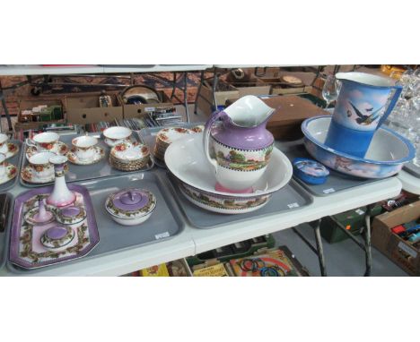 Jug and basin wash set with matching lidded soap dish jug and basin decorated with swallows in flight and butterflies togethe