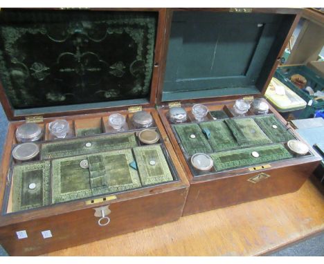 Two late 19th/early 20th century travelling vanity cases/dressing table boxes, both containing the original bottles and lined