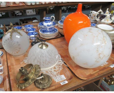 Selection of glass light fittings and a vase in orange glass with a narrow neck.  Glass fittings to include: two brass penden