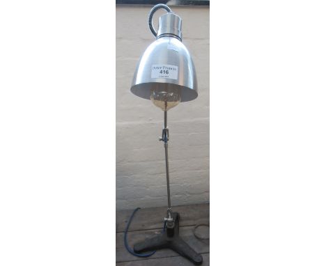 Brushed steel angle poise type desk lamp with cast iron triform base.(B.P. 21% + VAT) 