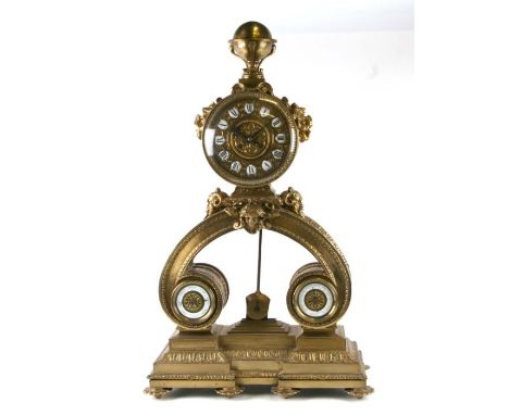 An impressive gilt brass mantle clock, the brass dial with enamel Roman numerals, with barometer and thermometer beneath, the