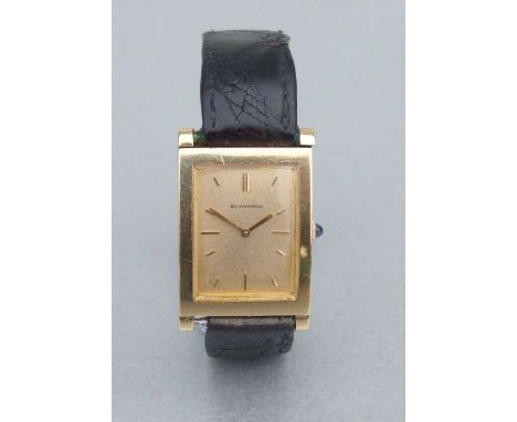 A Boucheron 18ct gold watch cased gentleman's wrist watch, the square gold dial with baton markers and having a sapphire cabo