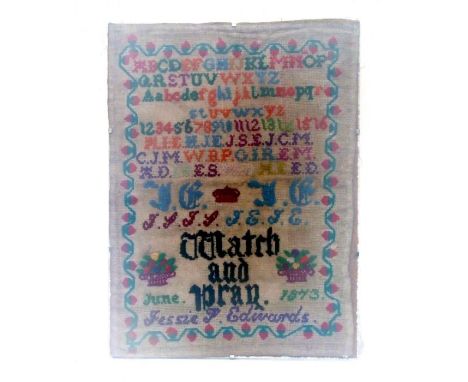 A Victorian needlework sampler,  Jessie Edwards 1873, with alphabet, numbers and 'Watch and Pray' within a scrolling foliate 