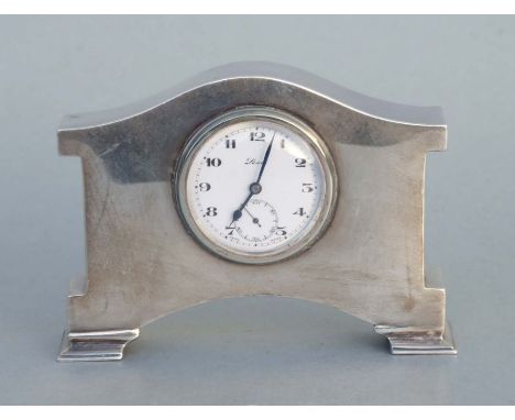 A small silver mantle clock, Birmingham 1927, the white enamel dial with Arabic numerals and subsidiary seconds dial, 12cms w