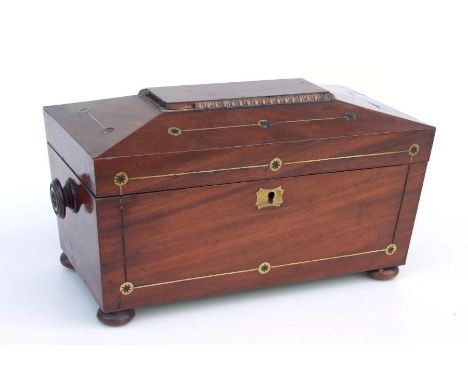 A Regency brass inlaid mahogany tea caddy of sarcophagus form, 32cms wide.