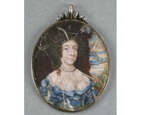 A 17th century Charles II period oval portrait miniature of a titled lady wearing a blue dress with a country house in the ba