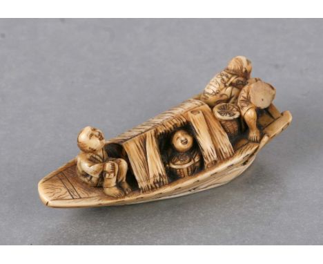 A 19th century Japanese ivory netsuke in the form of figures in a boat, two character mark to the underside, 5.5cms long.