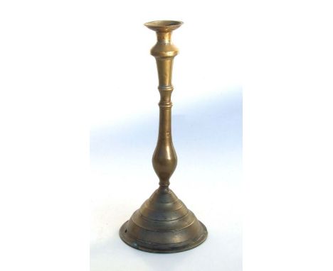 A large Ottoman brass candlestick on stepped circular base, 40cms high.Condition ReportThe base has been drilled to be conver