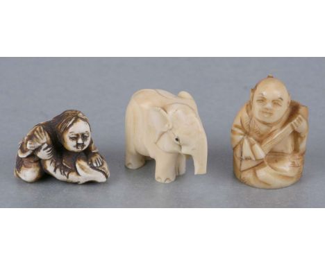 A Japanese ivory netsuke in the form of a fisherman and his fish; together with a similar ivory carving of a gentleman playin