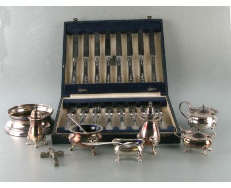 A cased set of silver plated dessert knives and forks, retailed by Garrard &amp; Co; together with a cased carving set; a sil