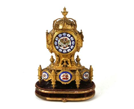 A 19th century continental gilt metal mantle clock, the painted enamel dial with Roman numerals, the gilt metal case with fig