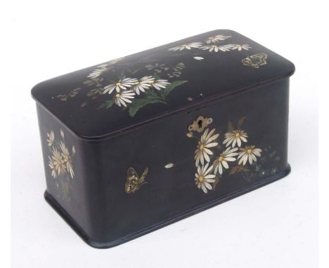 A Victorian black lacquer papier-mâché tea caddy decorated with flowers and butterflies, 22cms wide.