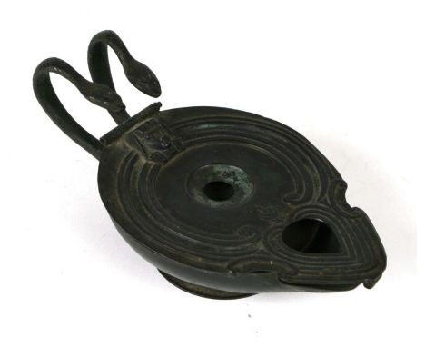 A Roman style lamp pastille burner with twin serpent handles, 17cms wide.