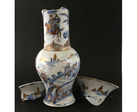 A Chinese Kangxi period (1661-1722) blue & white yen yen vase decorated with figures and warriors amongst clouds with gilt hi